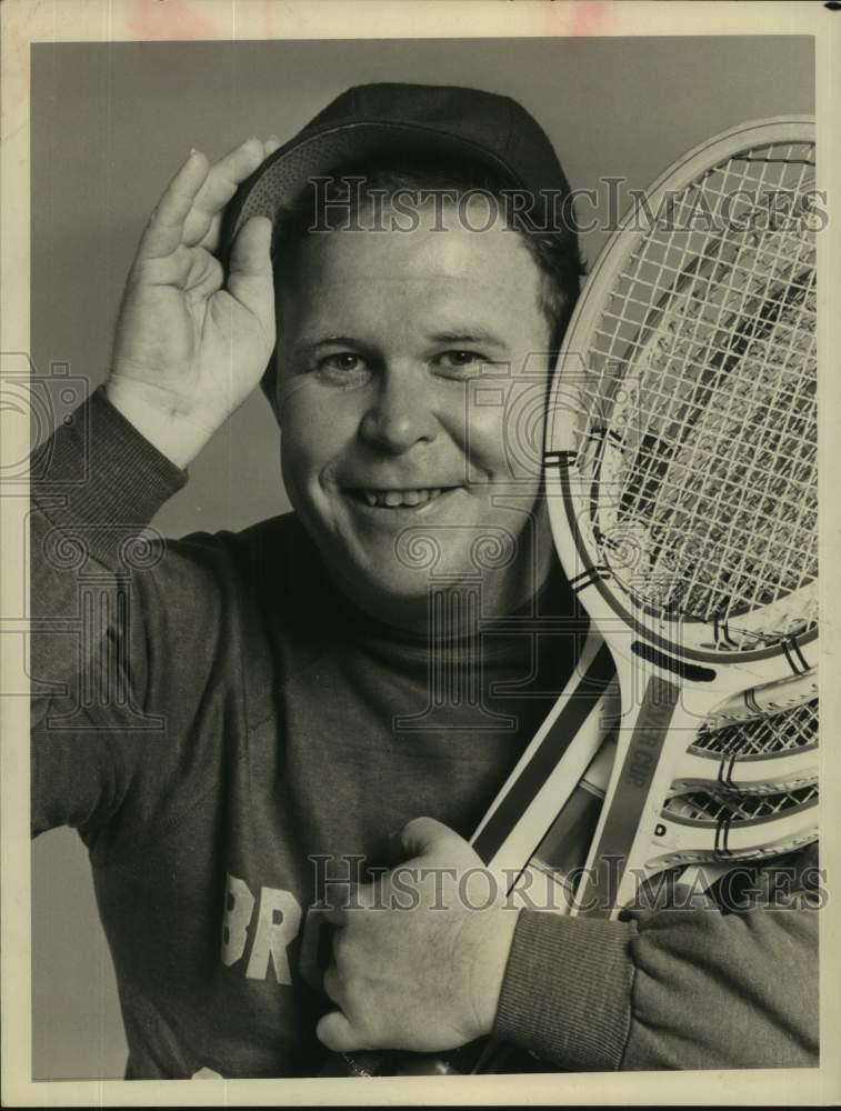 1977 Press Photo Actor Ned Beatty in closeup with armful of tennis rackets | eBay