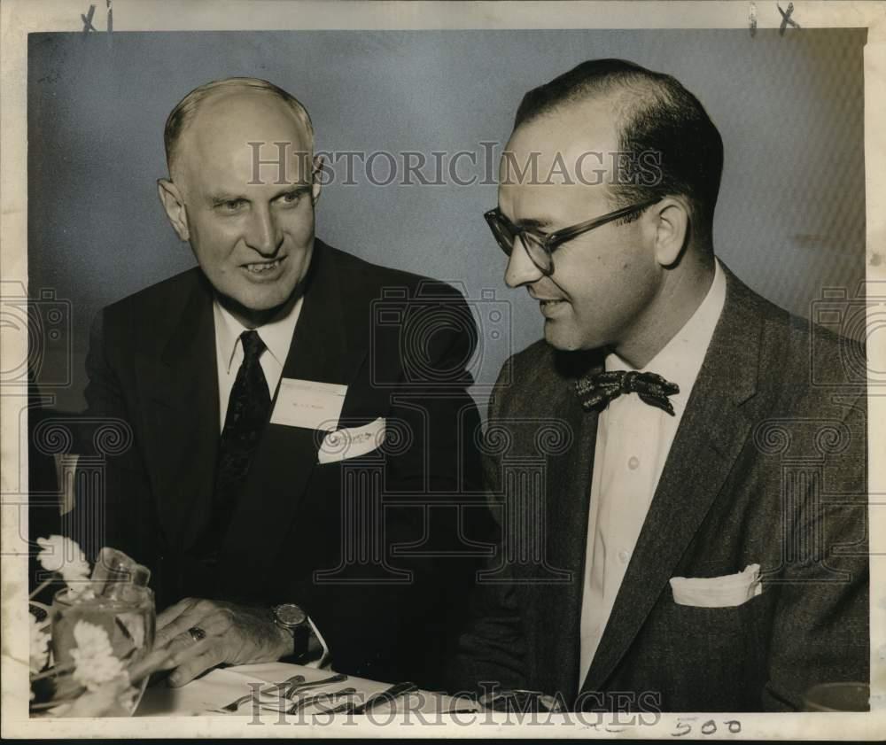 1956 Press Photo A. H. Weyland chats with Edward Steimel at oil and gas ...