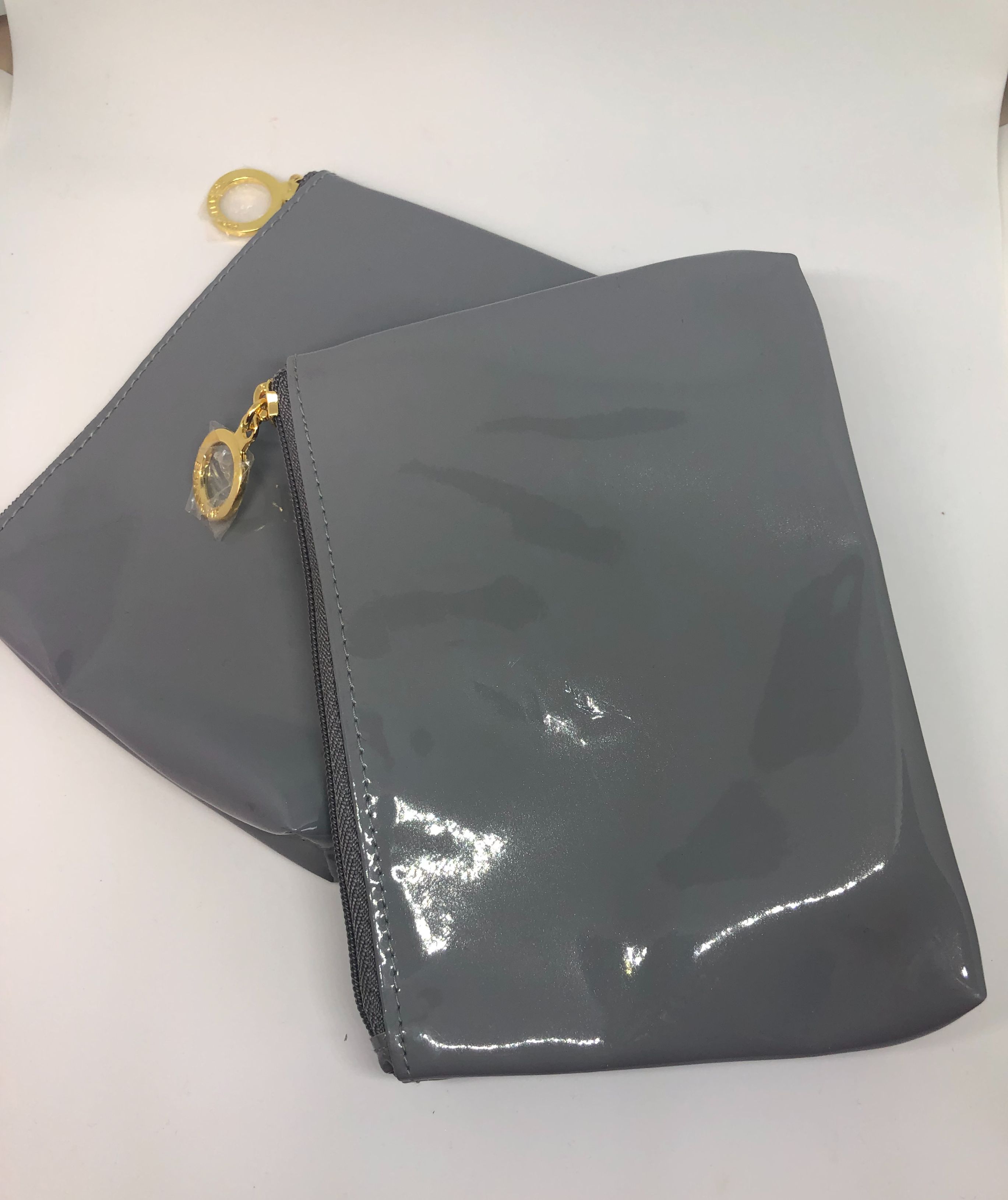 pale grey patent clutch bag